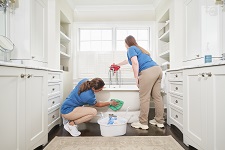 Maid Cleaning Bathroom